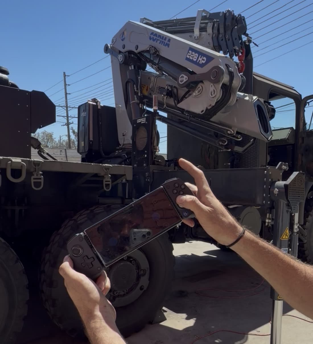 Handheld proportional controller operating the COPMA 228 HP knuckle boom