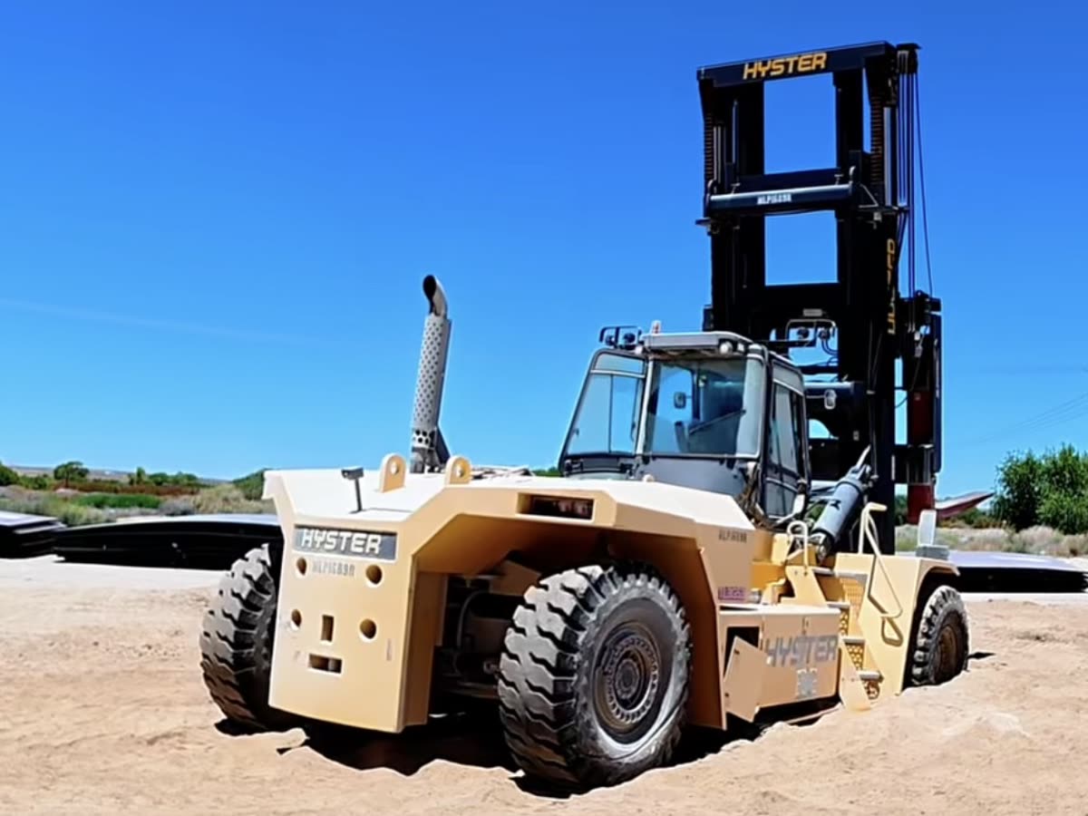 High-capacity container forklift on a dirt yard, the class of machine we are called out to recover