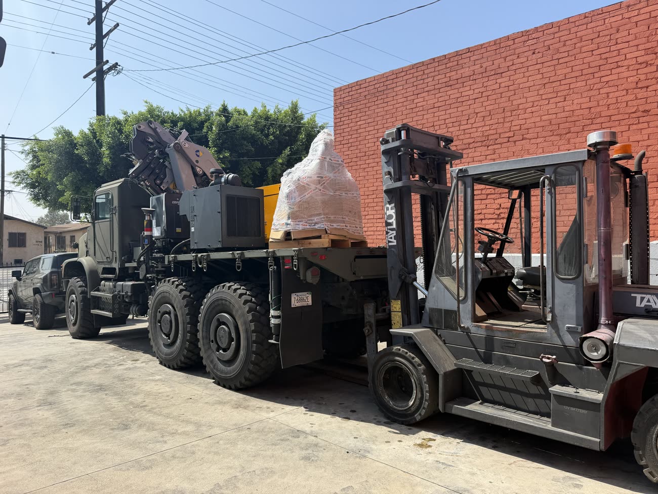 The COPMA crane truck loaded with a palletised load in our yard, the Taylor forklift alongside